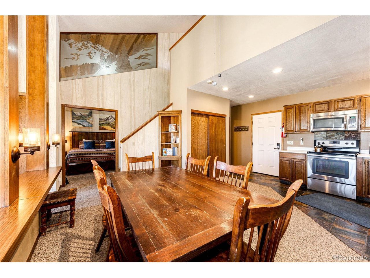96 Mountainside Drive, Unit 47 Granby, CO 80446 - Photo 12 of 42 a living room with stainless steel appliances kitchen island granite countertop furniture and a kitchen view