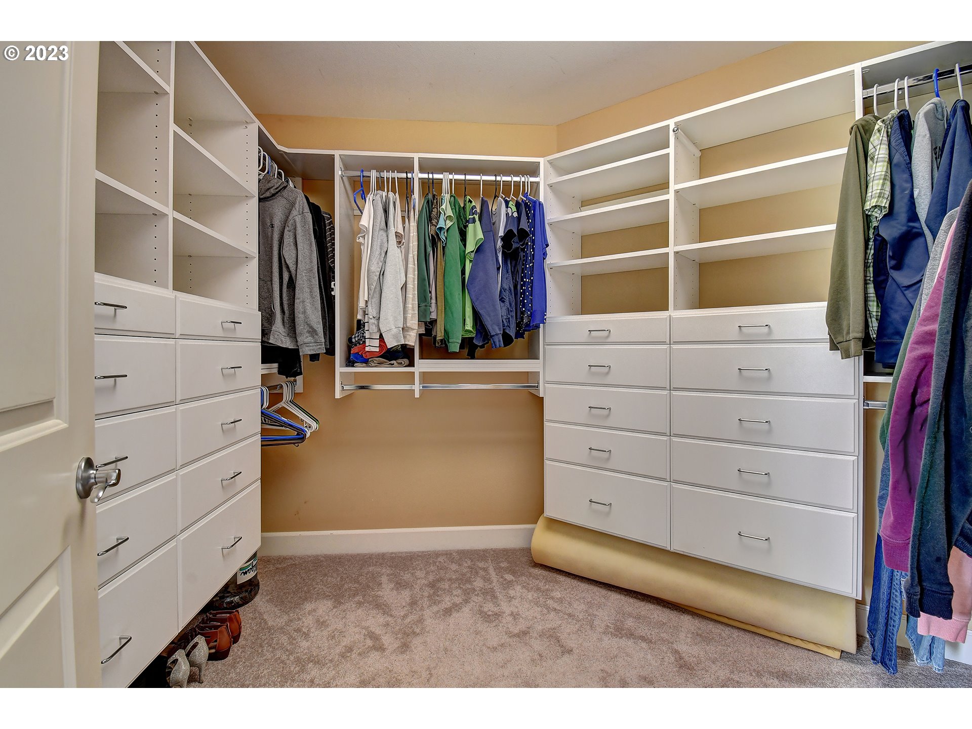 907 North 7th Circle Ridgefield, WA 98642 - Photo 21 of 47 a view of walk in closet with clothes and shoes