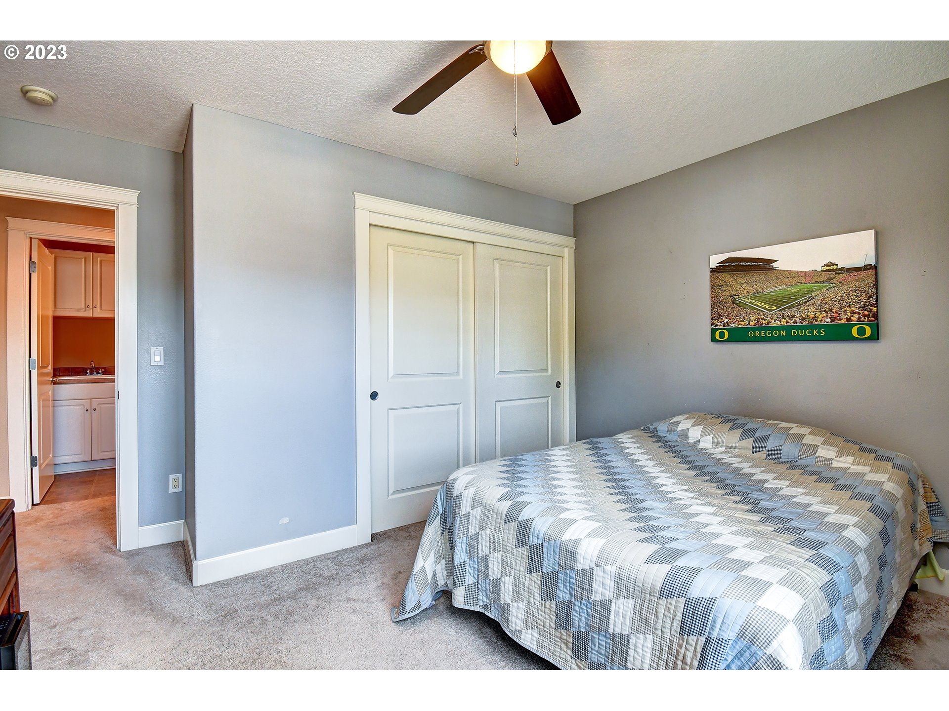 907 North 7th Circle Ridgefield, WA 98642 - Photo 26 of 47 a bedroom with a bed and a painting on the wall