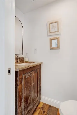 a white toilet sitting next to a white sink