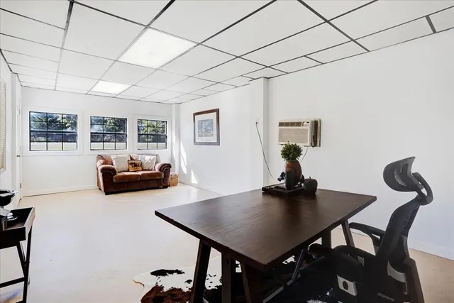 a bathroom with a mirror sink and a mirror