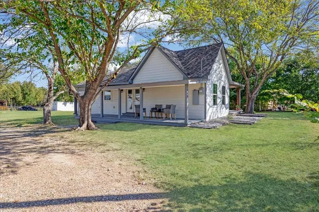 front view of a house with a yard