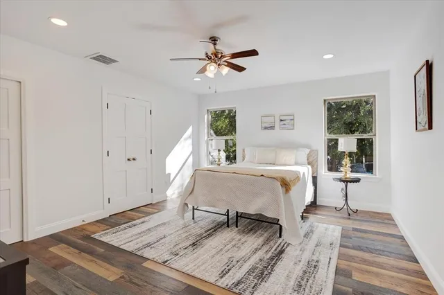 a bed room with a bed and a window