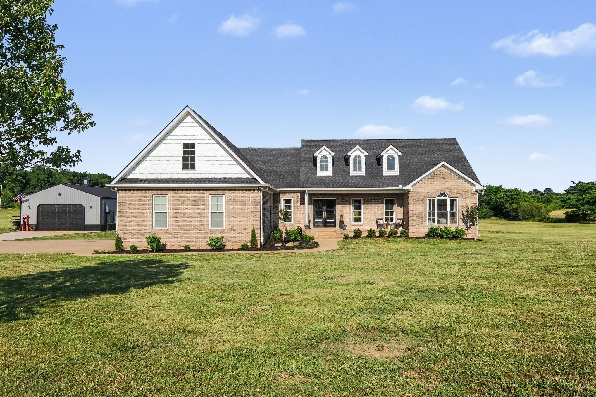 a front view of a house with a yard