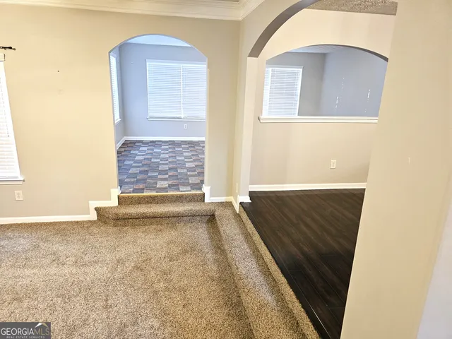 a view of livingroom with furniture and chandelier fan