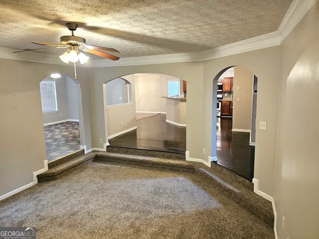 a view of entryway and hall with a front door