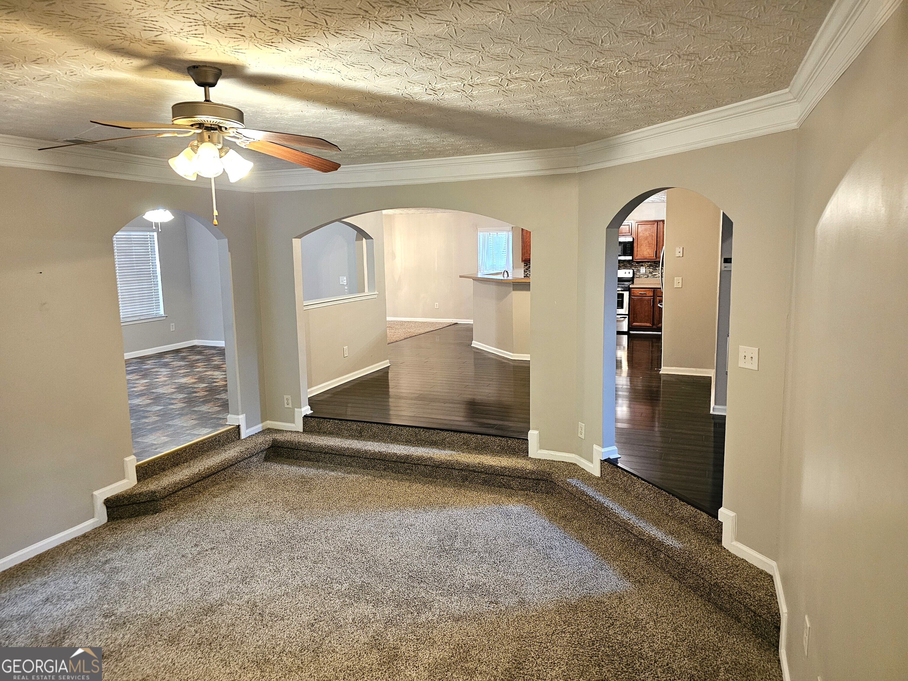 11223 Genova Terrace Hampton, GA 30228 - Photo 5 of 26 a view of livingroom with furniture and chandelier fan