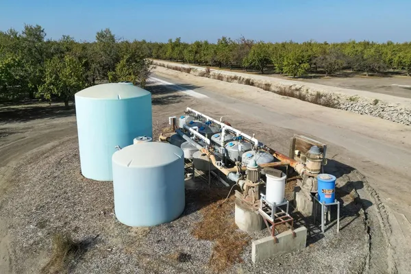 a view of a road with a trees in the background