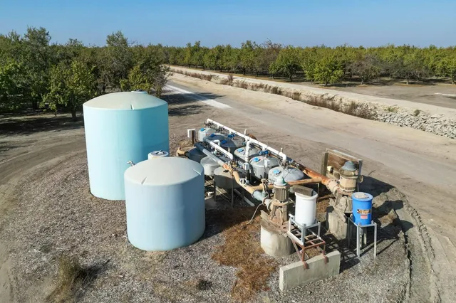 a view of a road with a trees in the background