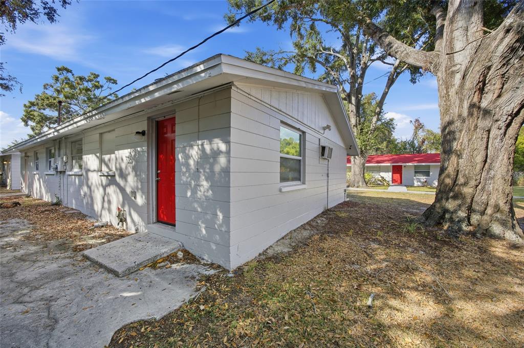 11733 North 12th Street, Unit G Tampa, FL 33612 - Photo 13 of 25 a front view of a house with a yard