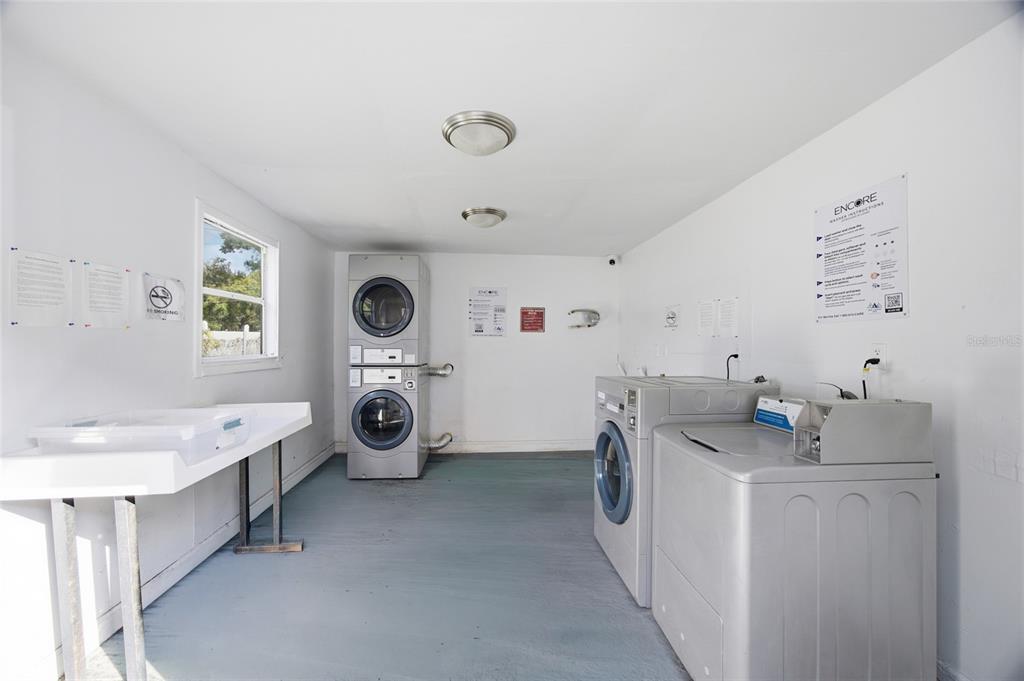 11733 North 12th Street, Unit G Tampa, FL 33612 - Photo 16 of 25 a utility room with cabinets washer and dryer