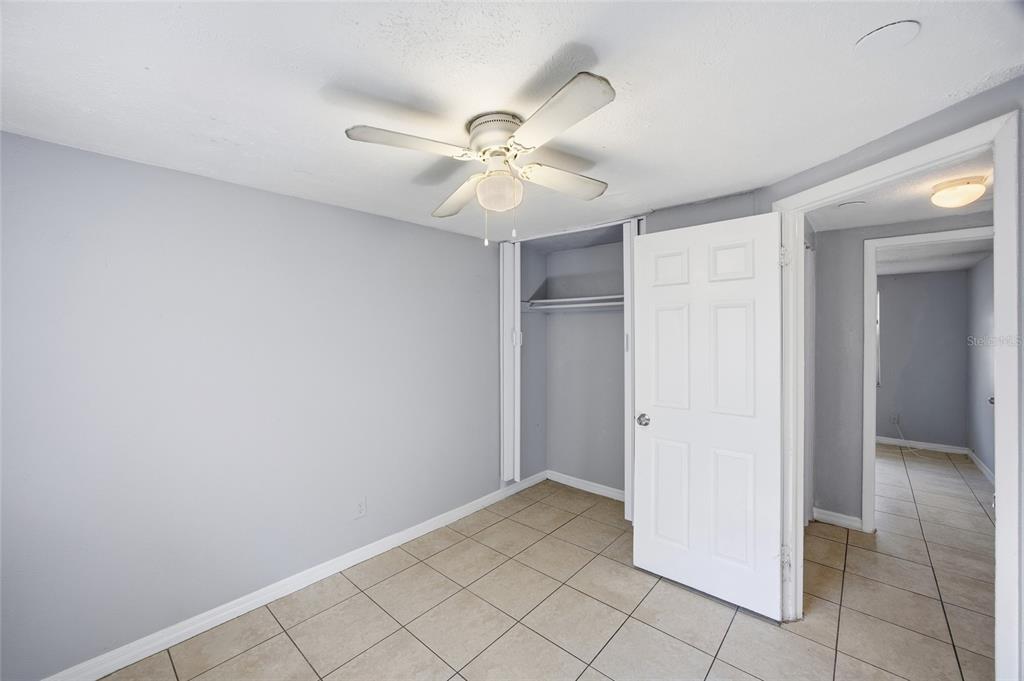 11733 North 12th Street, Unit G Tampa, FL 33612 - Photo 10 of 25 a view of a chandelier fan in a room
