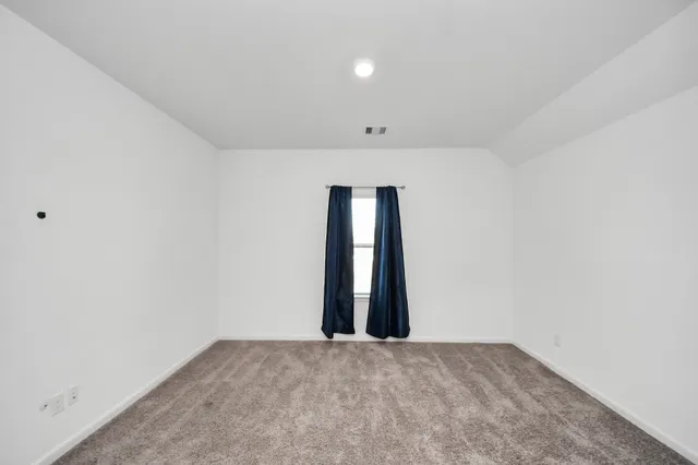 an empty room with a natural light