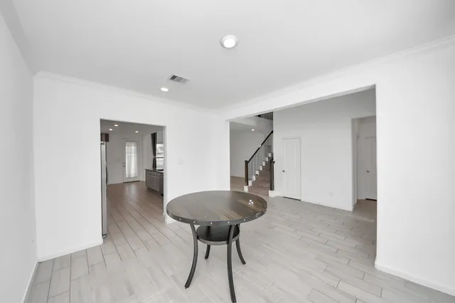 a view of a room with a table and a chandelier