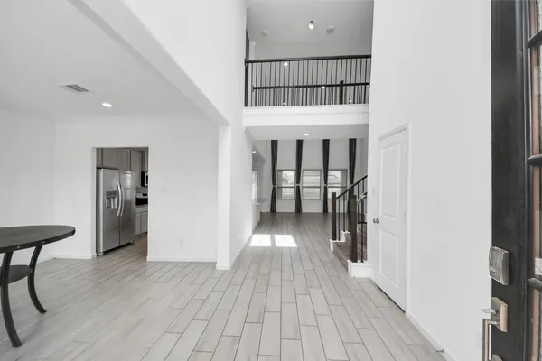 a view of entryway with wooden floor