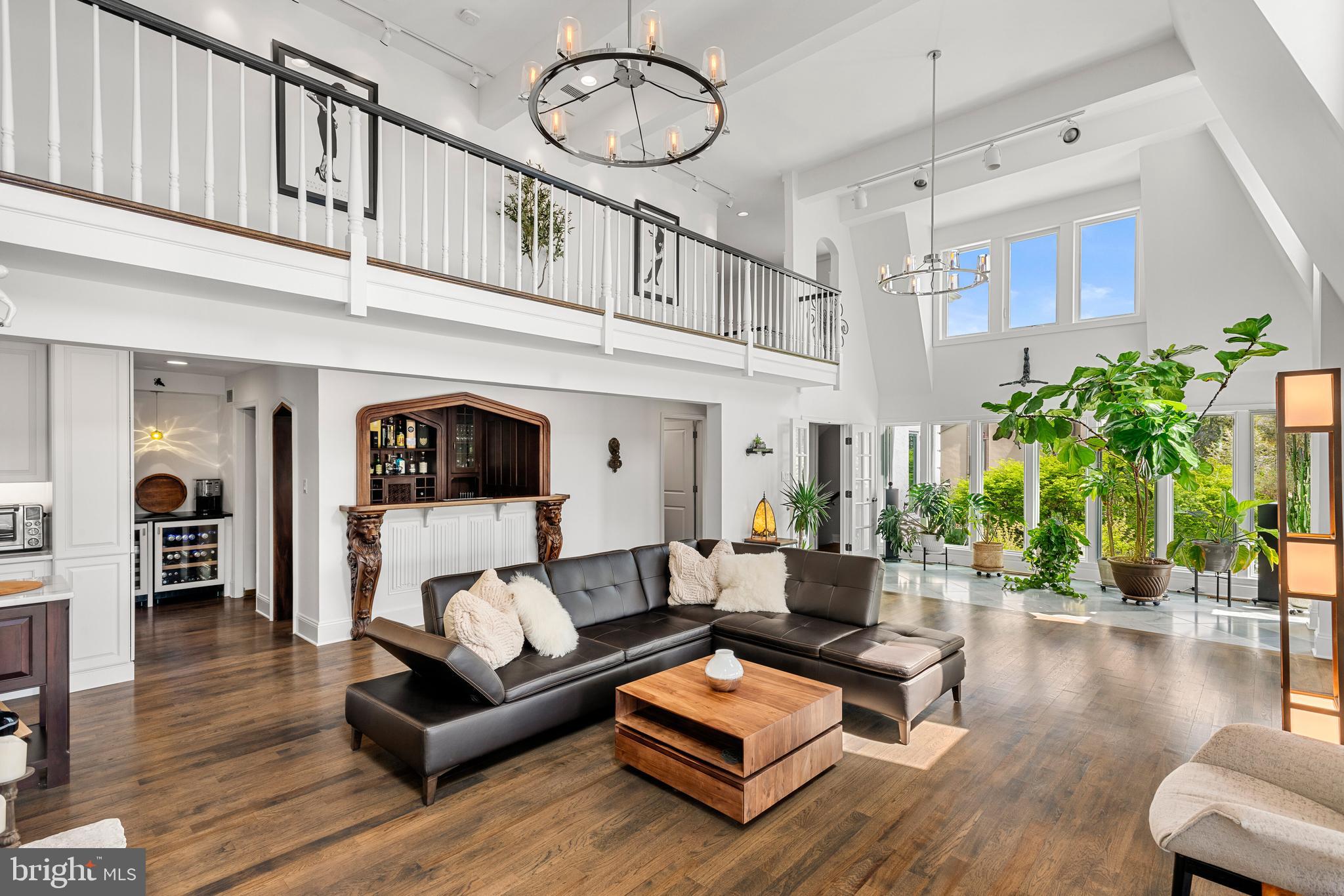 238 Ravenscliff Road Wayne, PA 19087 - Photo 14 of 74 a living room with furniture a fireplace and wooden floor