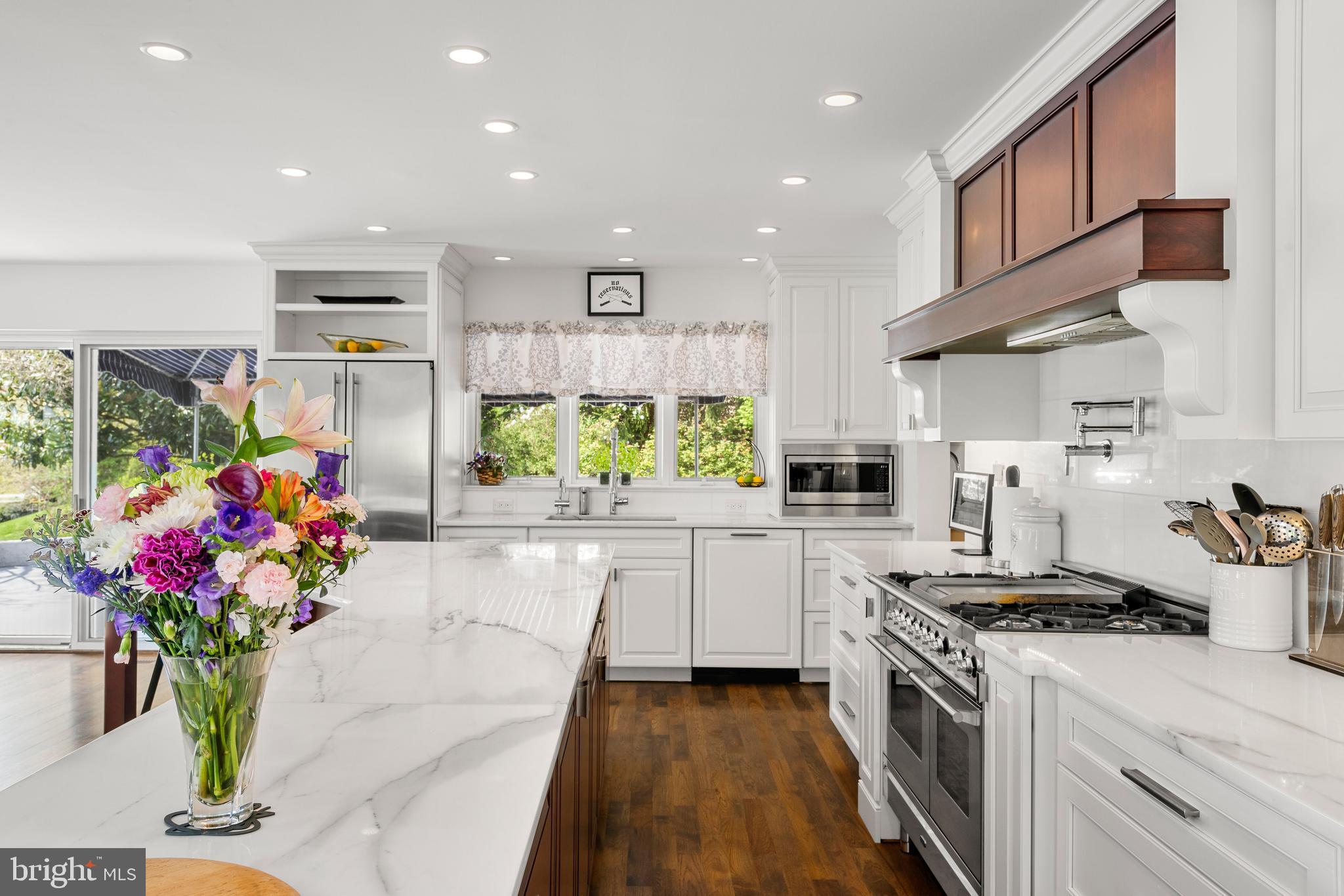 238 Ravenscliff Road Wayne, PA 19087 - Photo 28 of 74 a kitchen with stainless steel appliances granite countertop sink stove top oven and cabinets