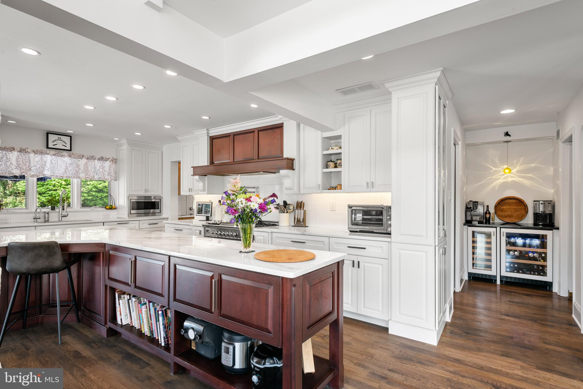 238 Ravenscliff Road Wayne, PA 19087 - Photo 29 of 74 a kitchen with stainless steel appliances granite countertop a kitchen island a stove and a sink