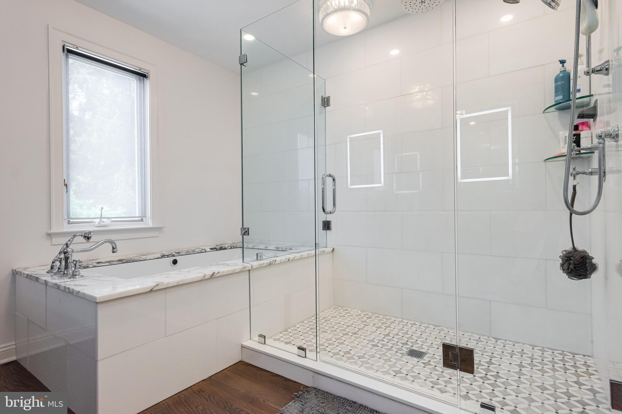 238 Ravenscliff Road Wayne, PA 19087 - Photo 44 of 74 a bathroom with a shower sink and mirror