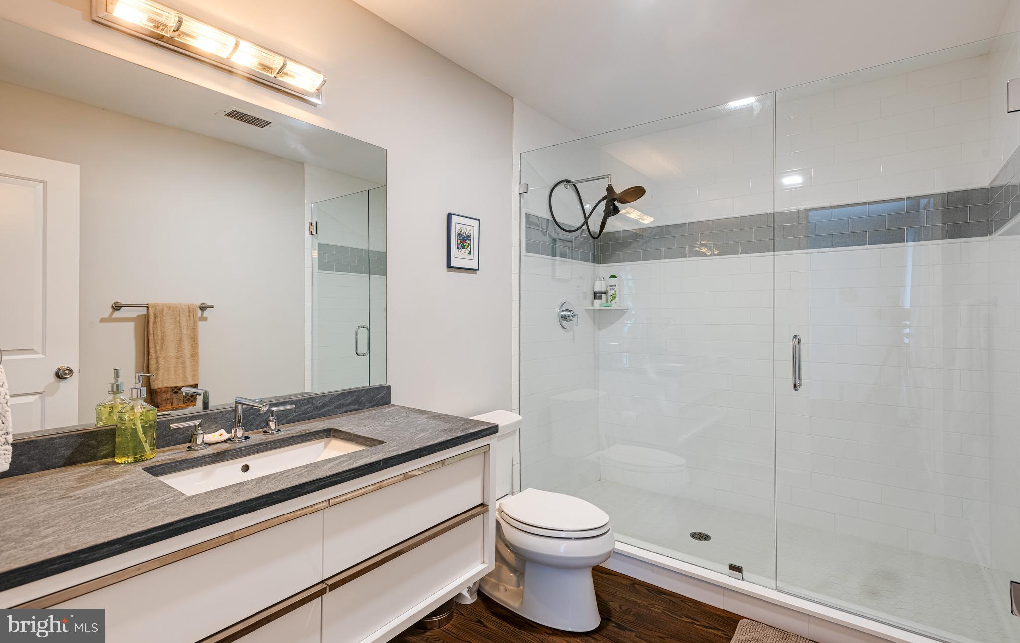 238 Ravenscliff Road Wayne, PA 19087 - Photo 47 of 74 a bathroom with a sink a toilet and shower