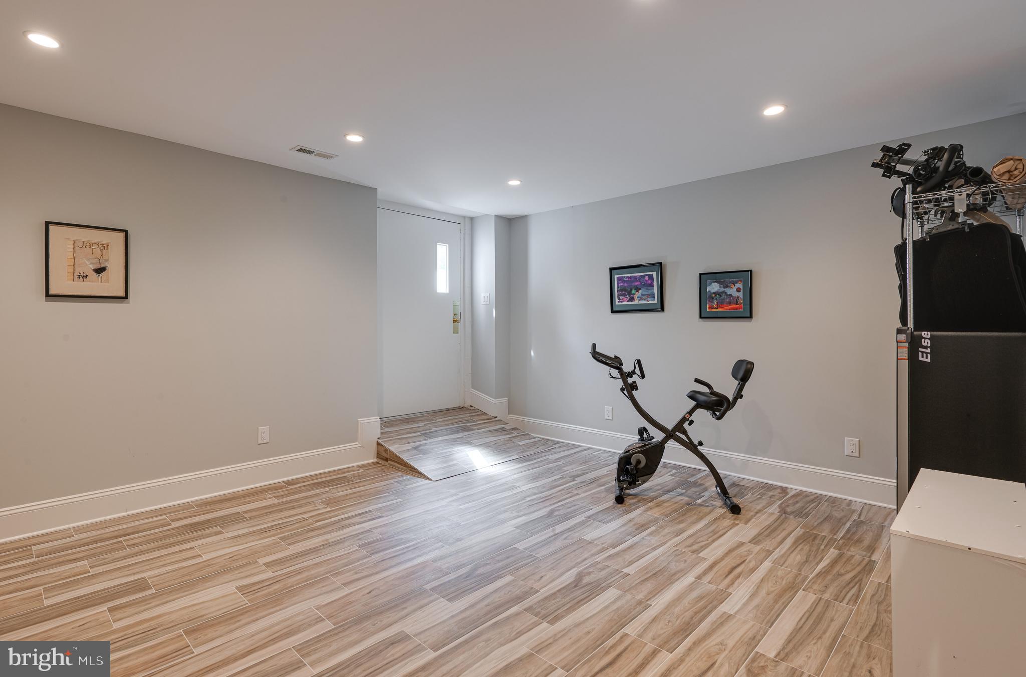 238 Ravenscliff Road Wayne, PA 19087 - Photo 52 of 74 a view of a room with wooden floor and black appliances
