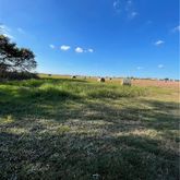 a view of an ocean and a yard