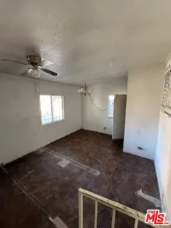 a view of an empty room and a window