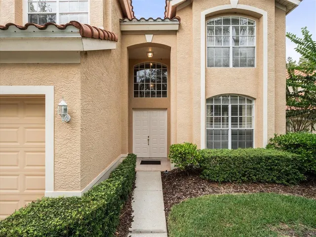 a white toilet sitting next to a shower curtain