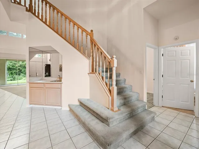 a kitchen with sink cabinets and window