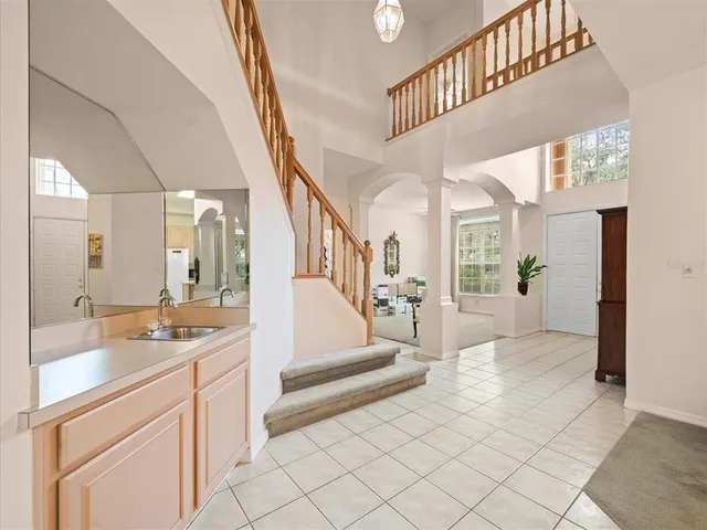 a kitchen with stainless steel appliances a sink and a refrigerator