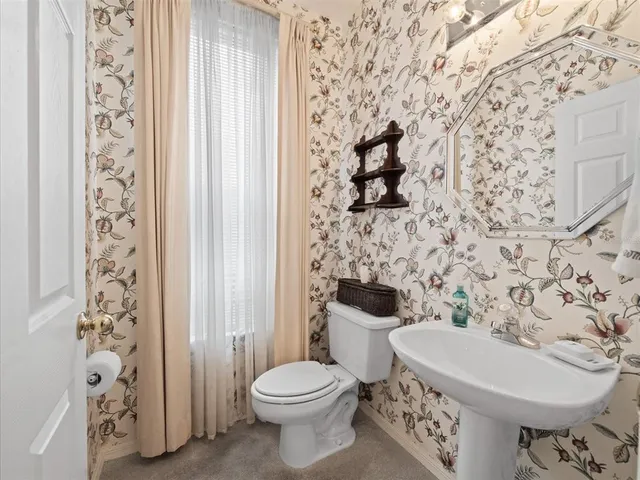 a kitchen with stainless steel appliances a sink stove and cabinets