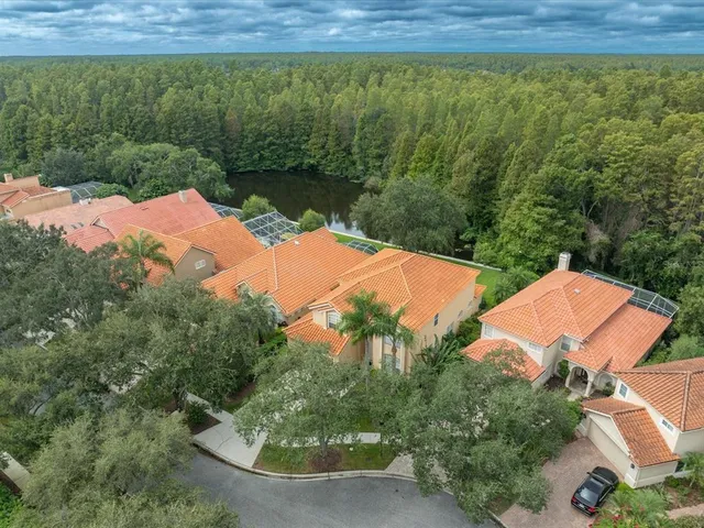 an aerial view of residential houses with outdoor space