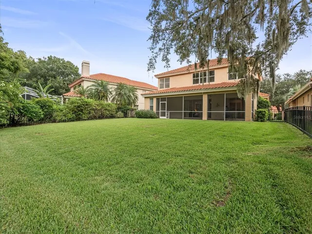 a view of a field and trees in the background