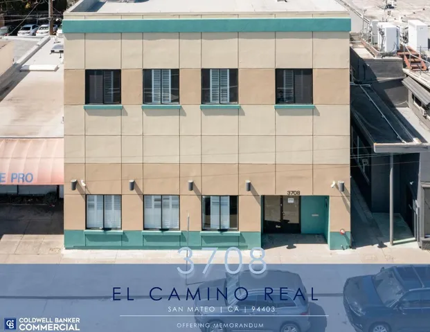 a view of a brick building with many windows