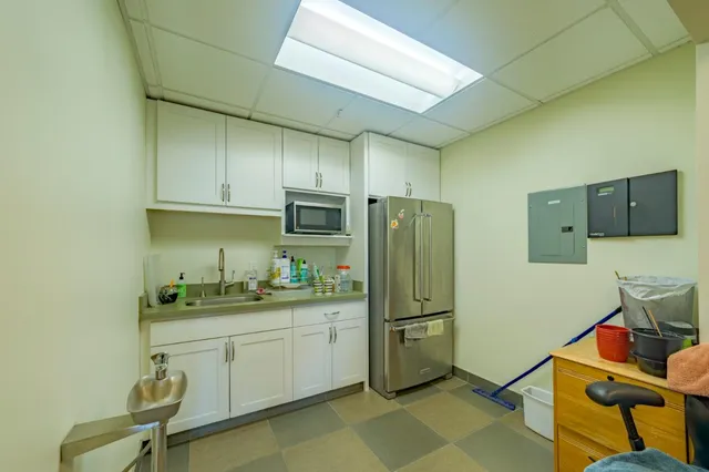 a bathroom with a shower and a glass door