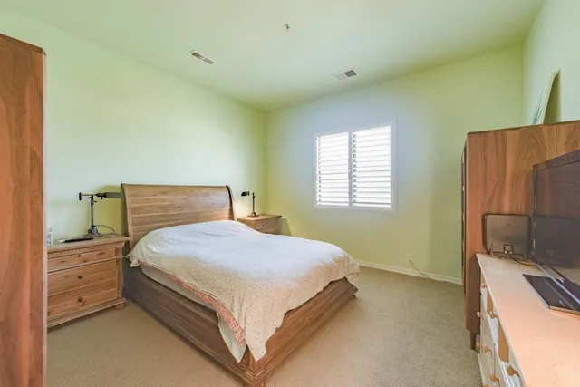a bedroom with a bed and a cabinets