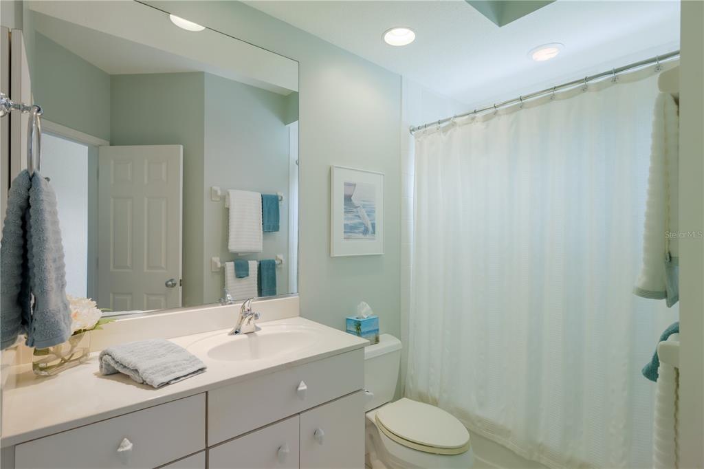 760 Seaboard Line Lane Boca Grande, FL 33921 - Photo 16 of 71 a bathroom with a sink toilet double vanity and shower