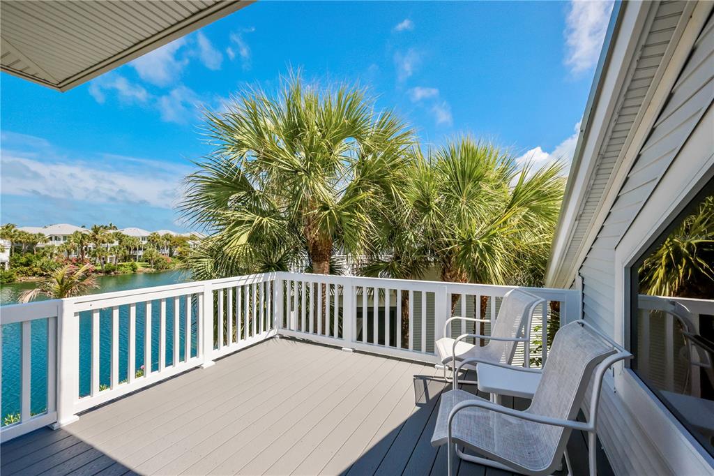 760 Seaboard Line Lane Boca Grande, FL 33921 - Photo 18 of 71 a view of a chair and table in the balcony