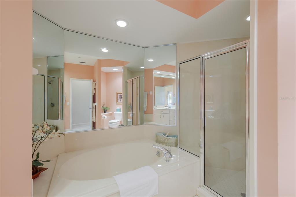 760 Seaboard Line Lane Boca Grande, FL 33921 - Photo 20 of 71 a bathroom with a bathtub and a shower