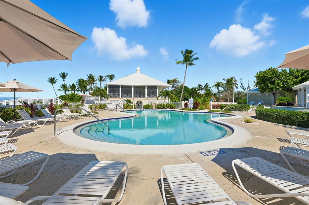 760 Seaboard Line Lane Boca Grande, FL 33921 - Photo 33 of 71 a view of a swimming pool with a patio