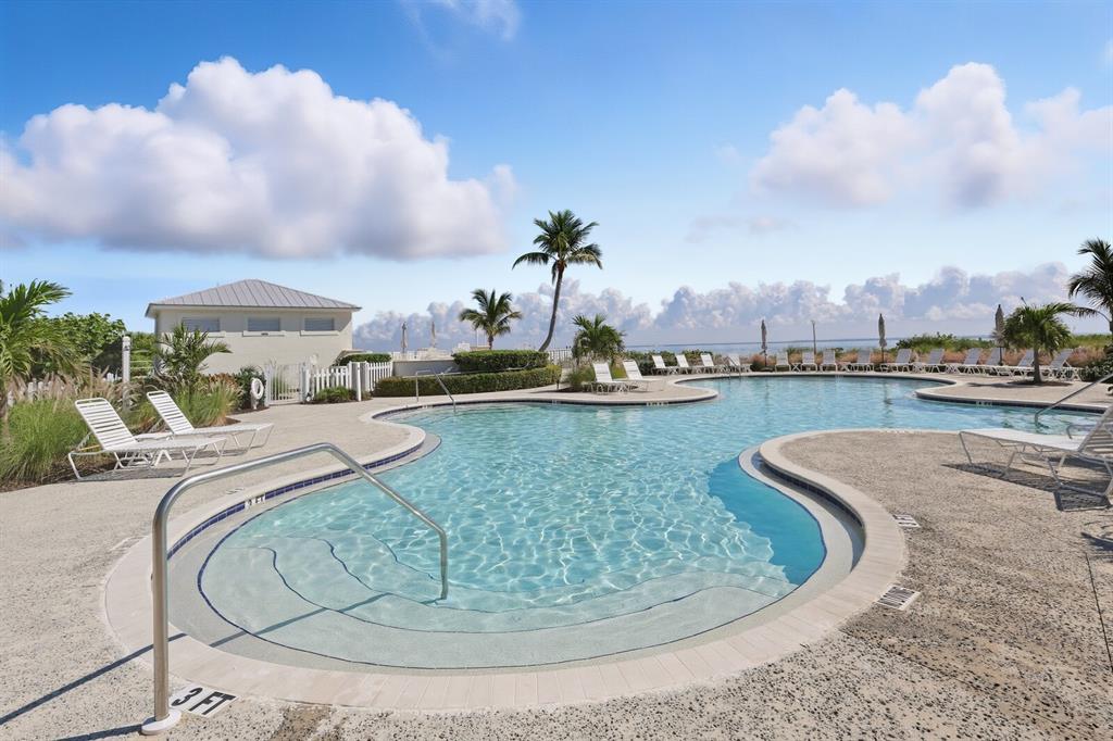 760 Seaboard Line Lane Boca Grande, FL 33921 - Photo 38 of 71 a view of a swimming pool with a lot of buildings