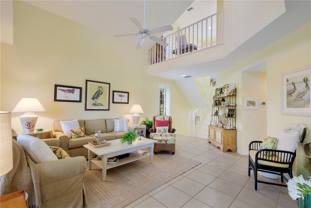 760 Seaboard Line Lane Boca Grande, FL 33921 - Photo 5 of 71 a living room with furniture and a chair
