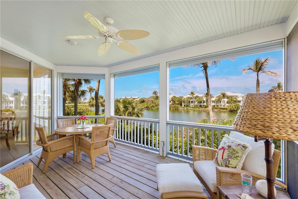 760 Seaboard Line Lane Boca Grande, FL 33921 - Photo 6 of 71 a living room with furniture floor to ceiling window and wooden floor