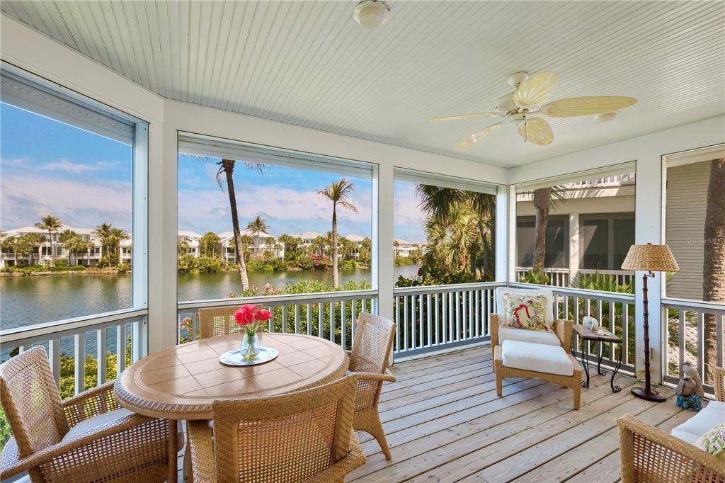 760 Seaboard Line Lane Boca Grande, FL 33921 - Photo 7 of 71 a view of a dining room and wooden floor