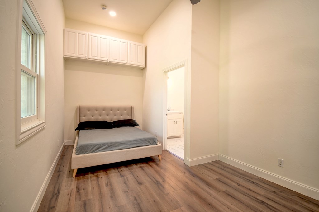 155 B Nimitz Road Kerrville, TX 78028 - Photo 19 of 30 a bedroom with a bed and a window