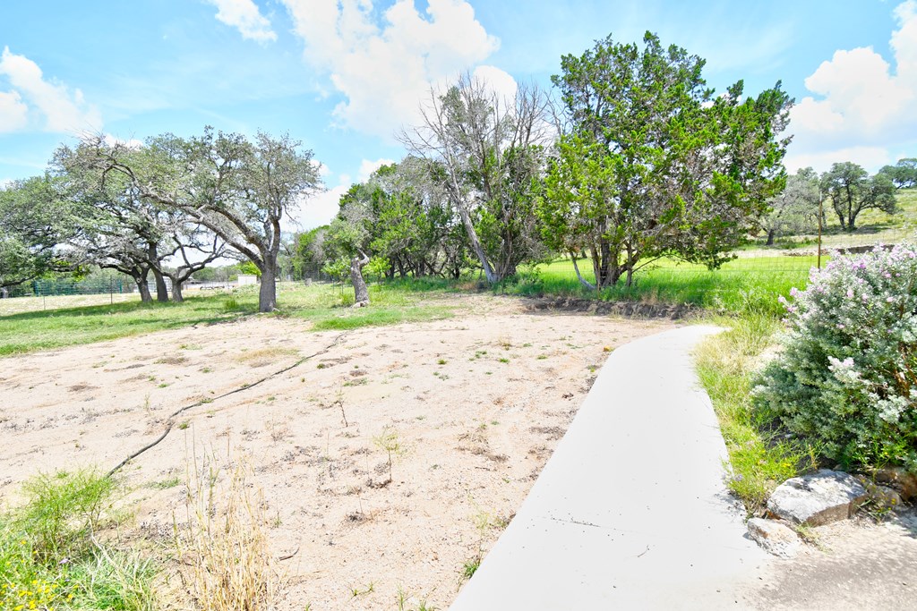 155 B Nimitz Road Kerrville, TX 78028 - Photo 24 of 30 a view of a backyard with a garden