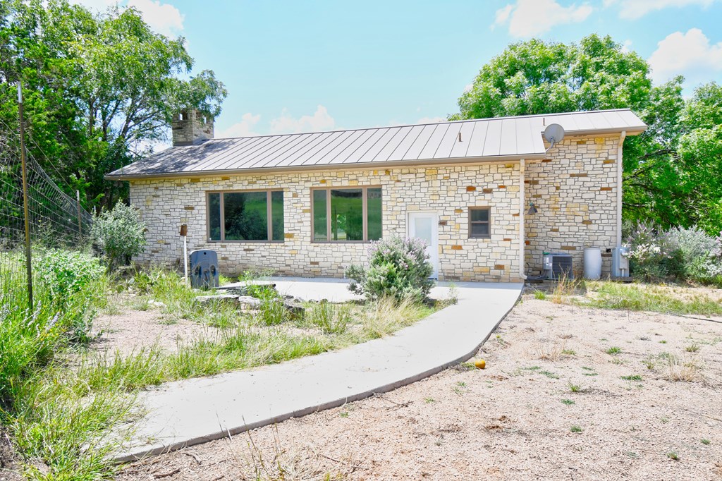 155 B Nimitz Road Kerrville, TX 78028 - Photo 25 of 30 front view of a house with a yard