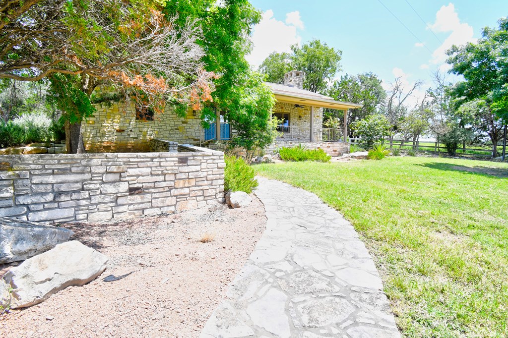 155 B Nimitz Road Kerrville, TX 78028 - Photo 27 of 30 a view of a house with a yard and pathway