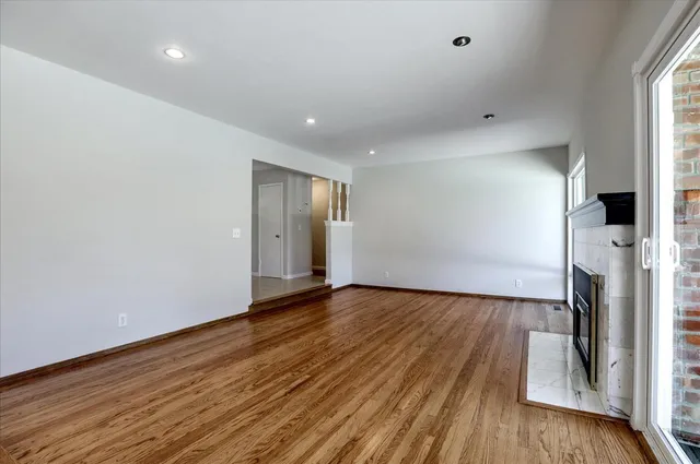 a view of livingroom with hardwood floor and a ceiling fan