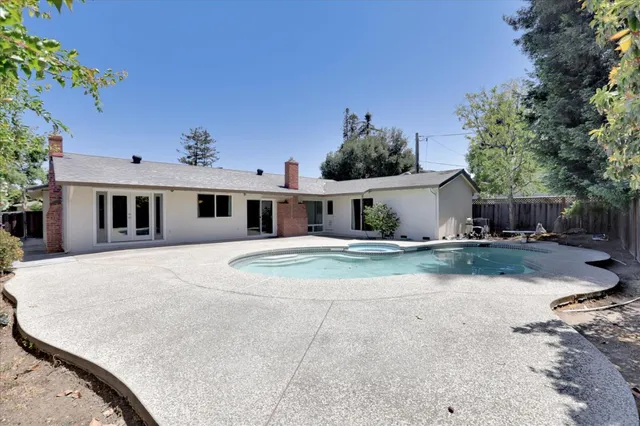 a front view of a house with a yard and a garage